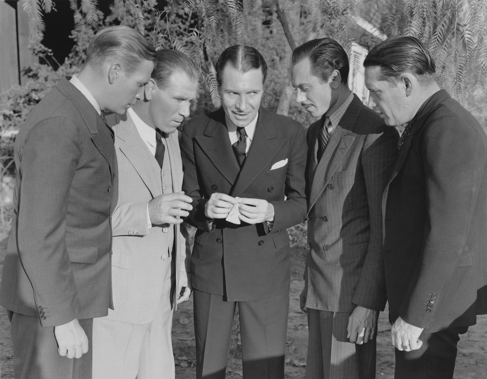 Photo of a group of men talking