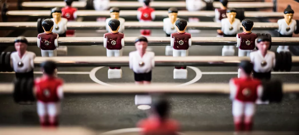 a field of pieces playing a game on a game table